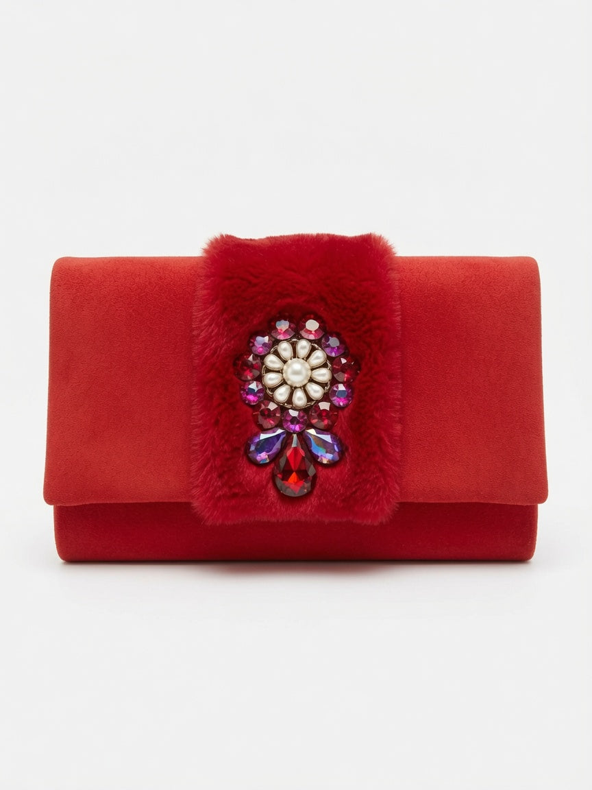 Elegant evening clutch in a rich red color with a soft, velvety texture