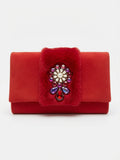 Elegant evening clutch in a rich red color with a soft, velvety texture