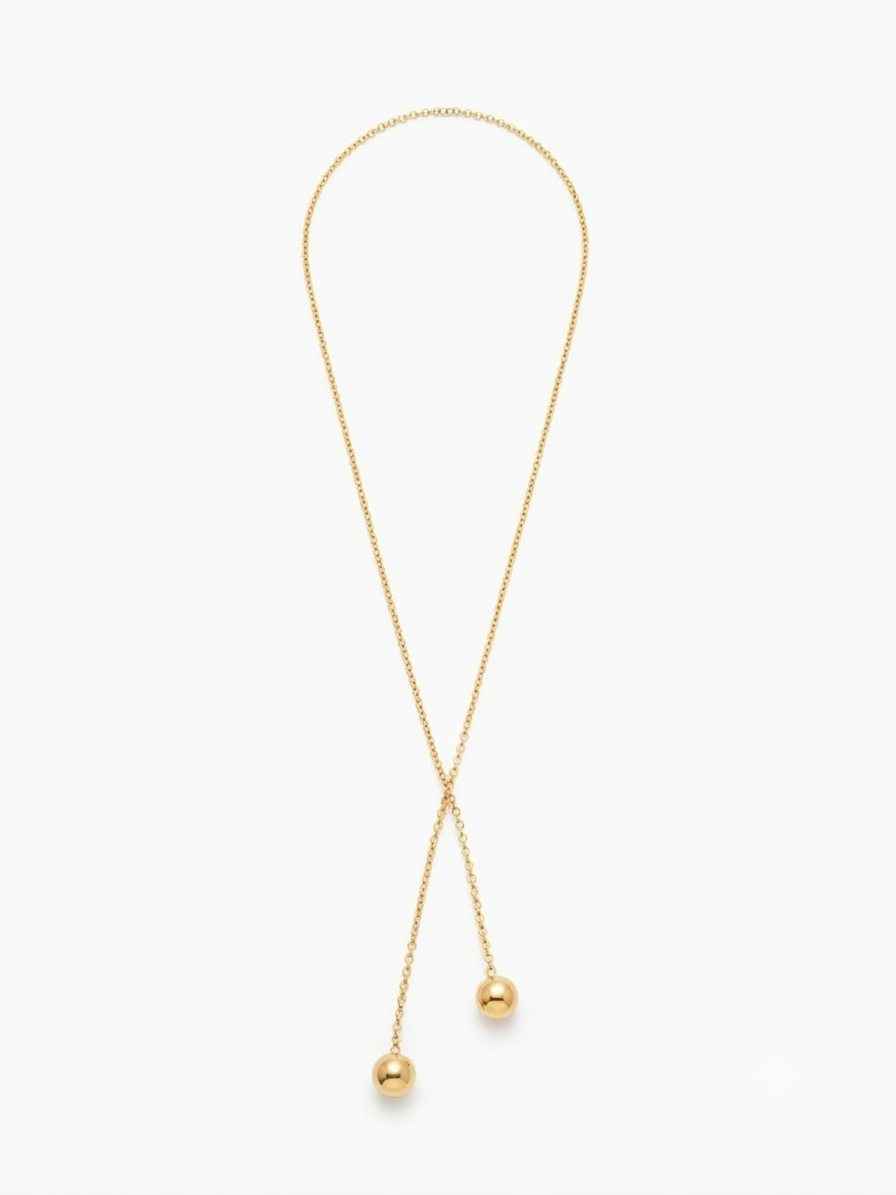 Colier-cravată (lariat) auriu elegant.