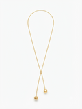 Colier-cravată (lariat) auriu elegant.
