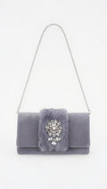 Gray velvet clutch with a fur insert and a crystal brooch