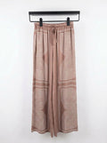 Wide-leg trousers with a geometric print — Italy,